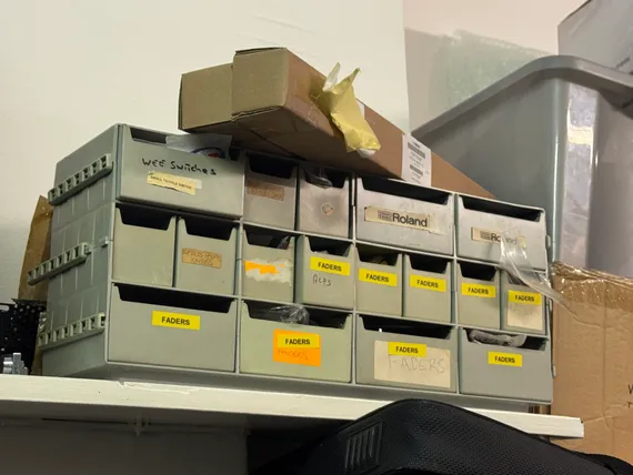 A plastic toolbox full of little drawers, most labeled 'FADERS.'