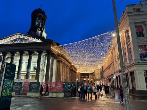 At night, a canopy of lights stretches from the neoclassical Gallery of Modern Art across a walkway to the building next door.