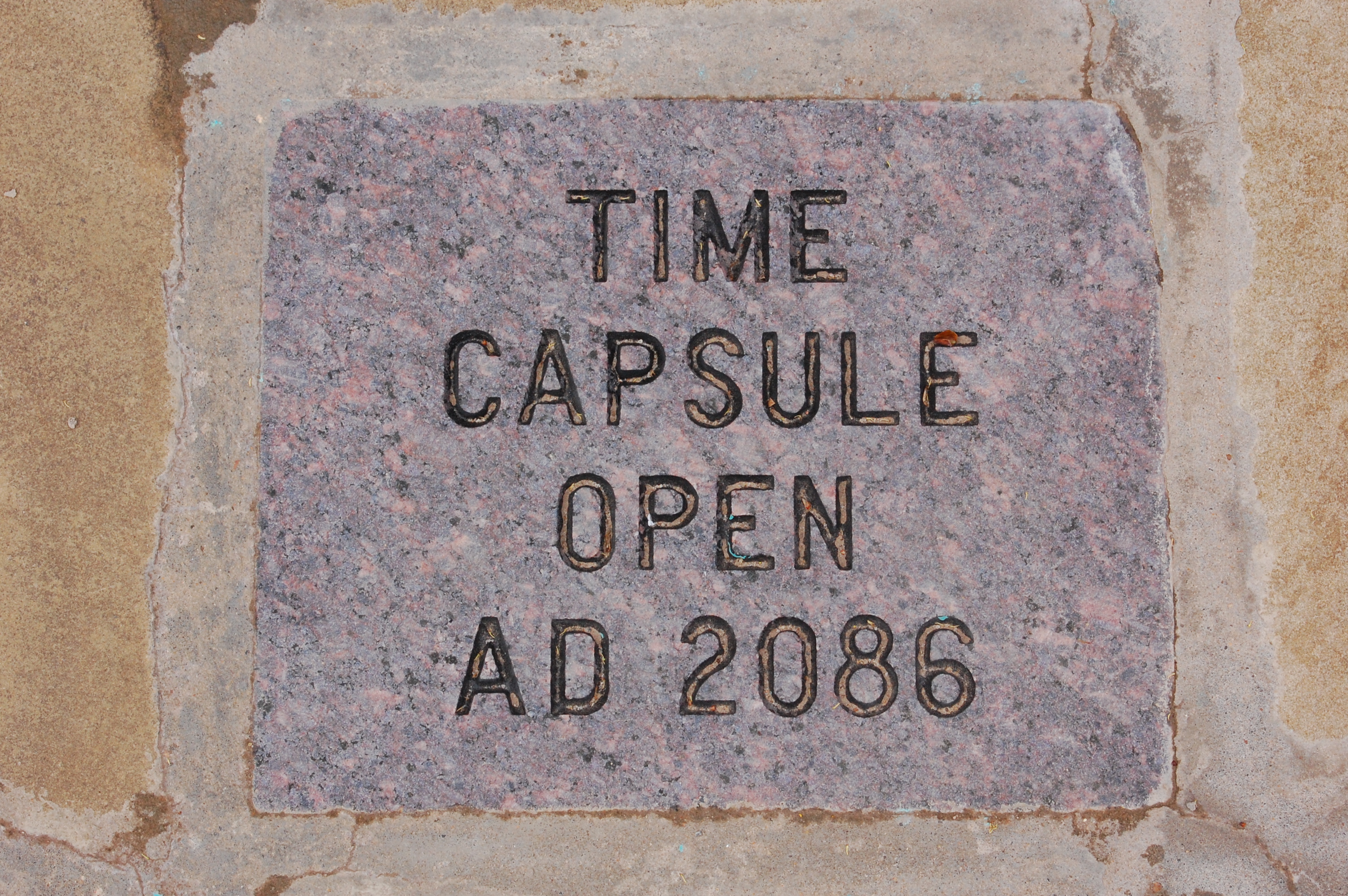 A plaque that reads: TIME CAPSULE OPEN AD 2086